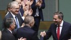 Prime Minister Anthony Albanese and Treasurer Jim Chalmers shake hands on budget day.