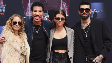 Lionel Richie with his children, Nicole, Sofia and Miles in March.