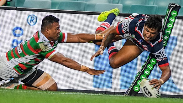 Acrobatic: Latrell Mitchell touches down in the corner.