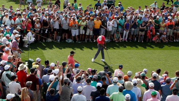 Fan favourite: Tiger Woods tees off during the third round of the Masters