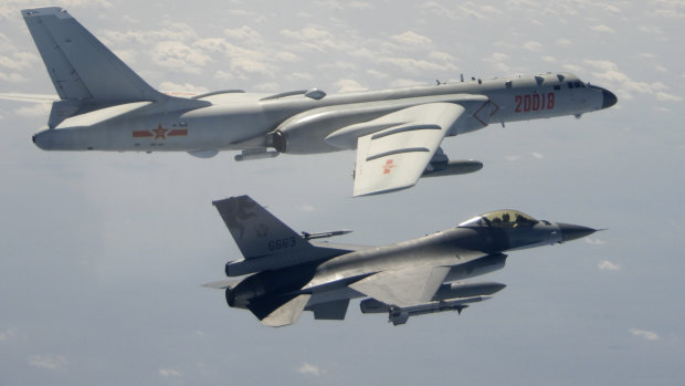 A Taiwanese Air Force F-16 in the foreground flies on the flank of a Chinese People’s Liberation Army Air Force H-6 bomber in 2020. 