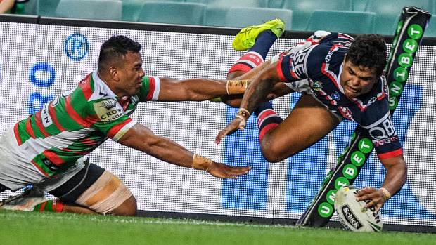 Acrobatic: Latrell Mitchell touches down in the corner.