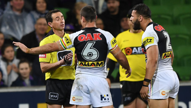 Penrith's James Maloney (left) and Josh Mansour argue with the ref.