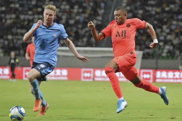 Harry van der Saag goes up against Kylian Mbappe.