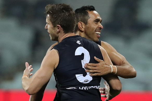 Marc Murphy celebrates a goal with Eddie Betts.