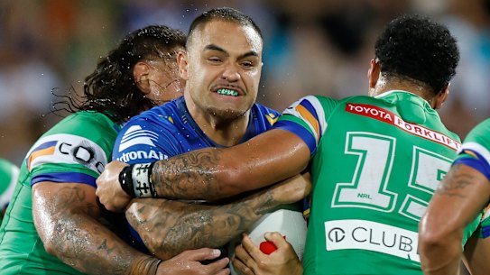 Dylan Walker of the Eels is tackled.