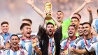 Lionel Messi lifts the FIFA World Cup Qatar 2022 Trophy. 