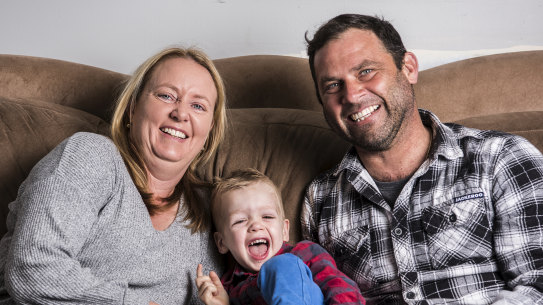Felicity and Adam Moreau with their adopted son, Christian.