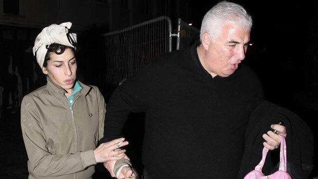 Winehouse with her father Mitch in 2008.