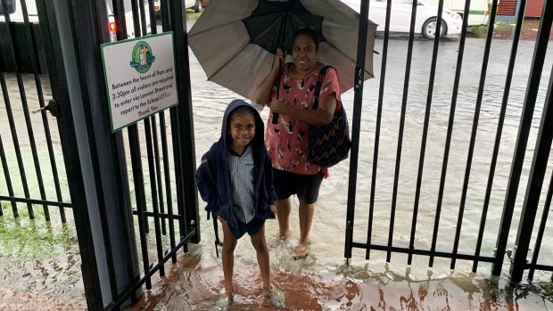 A student arrives at St Joseph's School in Cairns on Wednesday.