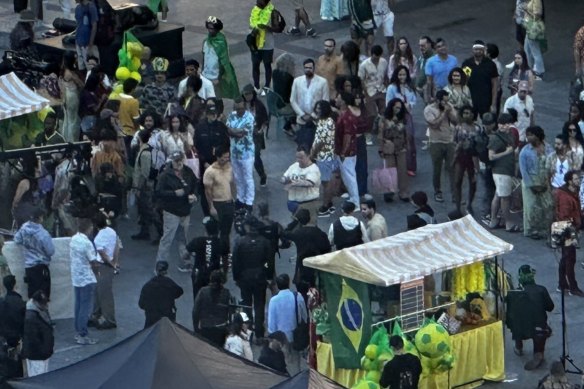Mark Wahlberg (mustard shirt) as seen from the Brisbane Times newsroom.