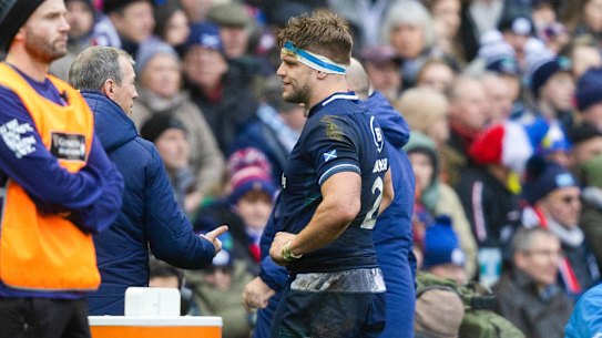 Scotland’s George Turner leaves the field for an HIA during the Six Nations match against France on Sunday (AEDT).