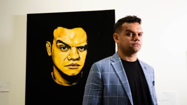 Meyne Wyatt with his self-portrait that won the Packing Room Prize at this year's Archibald Prize. 