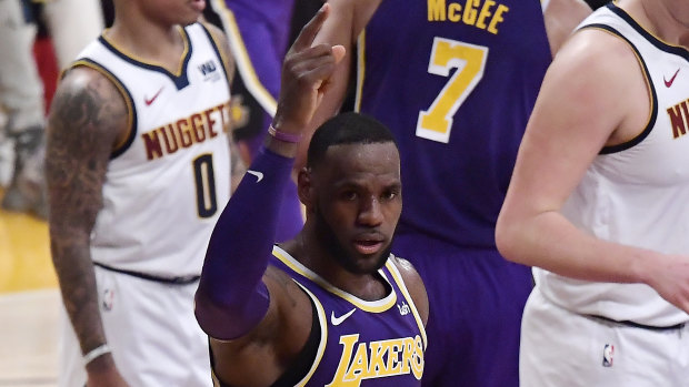 LA Lakers forward LeBron James gestures after scoring a basket that moved him past Michael Jordan on the NBA career scoring list.