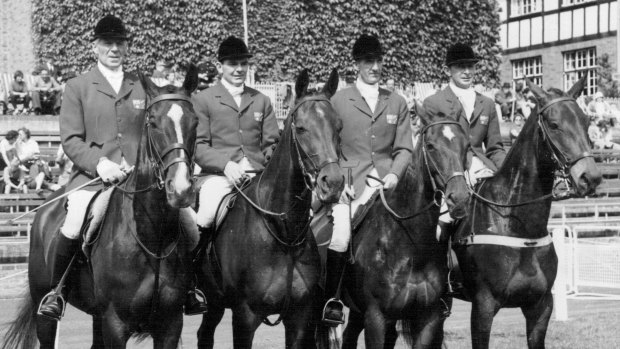 The Australian Olympic Equestrian team: (Left to Right) Laurie R. Morgan (Capt.) on 'Salad Days'; Neale Lavis on 'Mirrabooka'; William Roycroft on 'Our Solo'; and Bryan Crago on 'Sabre'. 