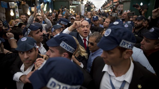 Israeli Prime Minister Benjamin Netanyahu visits a market in Tel Aviv.