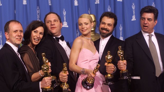 From left to right, David Parfitt, Donna Gigliotti, Harvey Weinstein, Gwyneth Paltrow, Edward Zwick and Marc Norman all celebrate after receiving the Oscar for best picture for Shakespeare In Love at the Academy Awards in 1999.