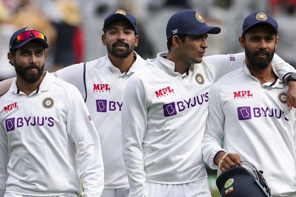 Indian players walk from the field at the close of play on day three of the second cricket test between India and Australia at the Melbourne Cricket Ground.