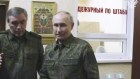 Russian President Vladimir Putin, right, accompanied by Russian Chief of General Staff Gen. Valery Gerasimov, second left, visits military headquarters in the Kursk region of Russia.
