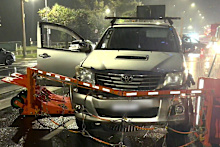 Chaos erupted at the gates of the Gold Coast 500 on Friday night after an alleged out-of-control driver ploughed into two pedestrians.