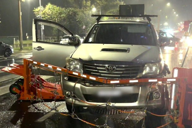 Chaos erupted at the gates of the Gold Coast 500 on Friday night after an alleged out-of-control driver ploughed into two pedestrians.