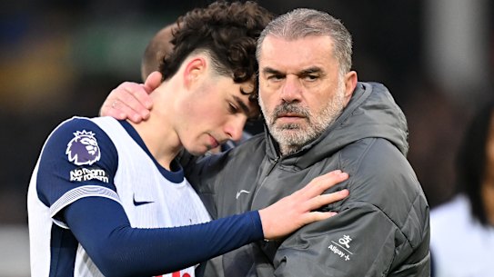 Ange Postecoglou consoles Archie Gray after Spurs loss.