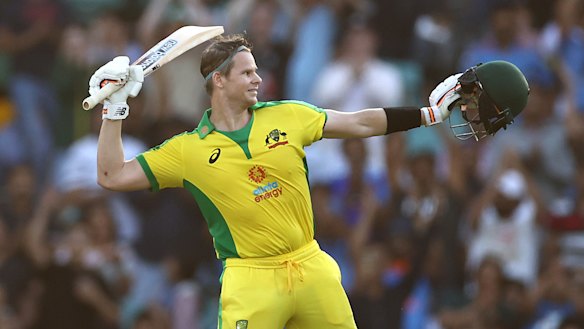 Steve Smith raises his bat after making a century.