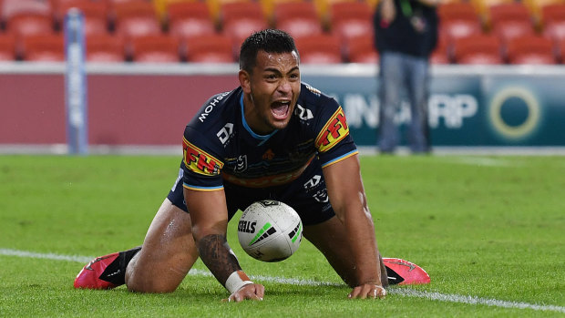 Phillip Sami of the Titans celebrates scoring the match-winning try against the Wests Tigers on Sunday.