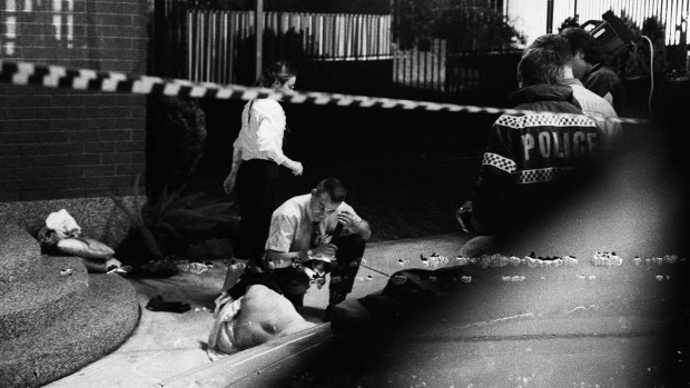 Police examining the scene of John Newman's murder, 5 September 1994.