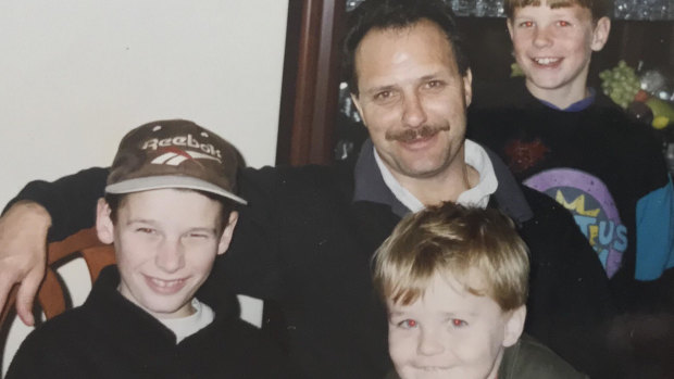 John Liveris with (left to right) Brendan, Conrad and Matthew in 1995.