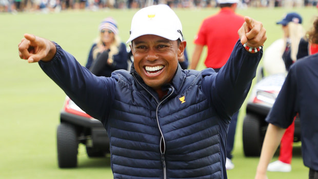 American captain Tiger Woods celebrates after clinching the Presidents Cup on Sunday.