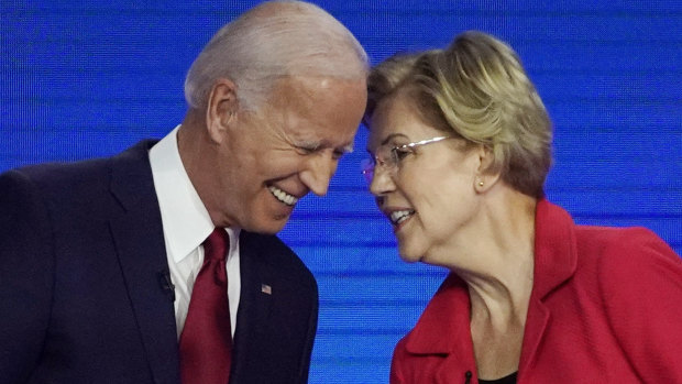 Democratic presidential contenders Joe Biden and Elizabeth Warren speak on stage  at the Democratic debate in Houston. He is now ahead of her in the polls.