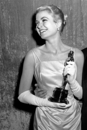 Oscar winner Grace Kelly poses with her statuette at the 1954 Academy Awards.