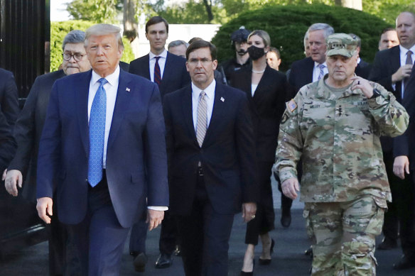 Army General Mark Milley, on the right in military fatigues, accompanied Donald Trump and the presidential entourage to the church.