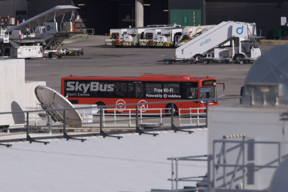International arrivals in Melbourne are transported directly from their plane to a bus before being driven to their hotels.