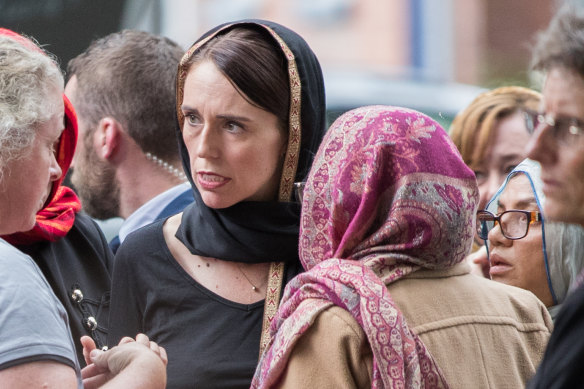 New Zealand Prime Minister Jacinda Ardern with members of Christchurch’s Muslim community the day after the mosque attacks.