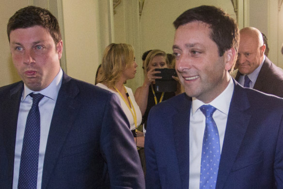 Opposition MP Tim Smith (left) and his leader, Matthew Guy, called for Daniel Andrews to resign on Wednesday.