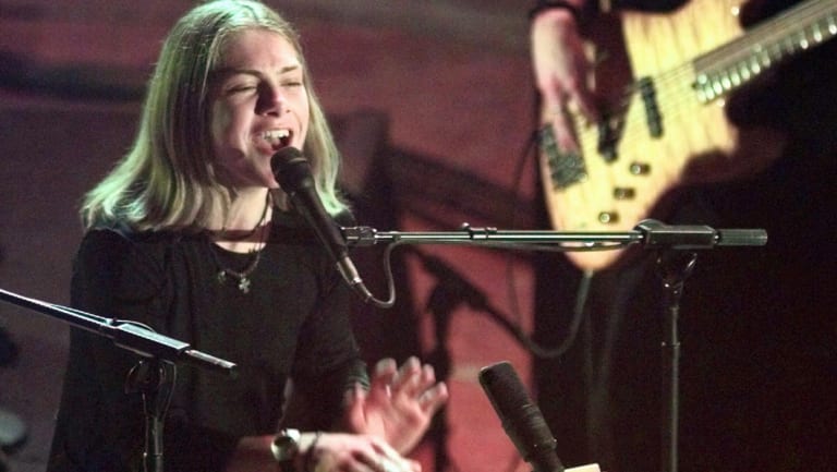 Taylor Hanson plays the bongo drums on stage at the 40th annual Grammy Awards in 1998.