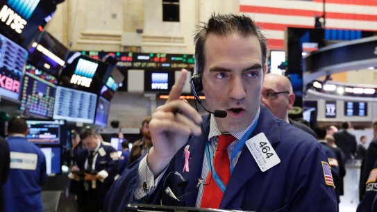 Trader Gregory Rowe works on the floor of the New York Stock Exchange, Monday, Oct. 17, 2016. Stocks are opening slightly lower on Wall Street, led by a decline in health care stocks. (AP Photo/Richard Drew)