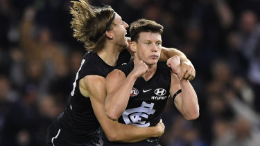 Fast starter: Sam Walsh (right) helped Carlton get out to a first-quarter lead against West Coast.