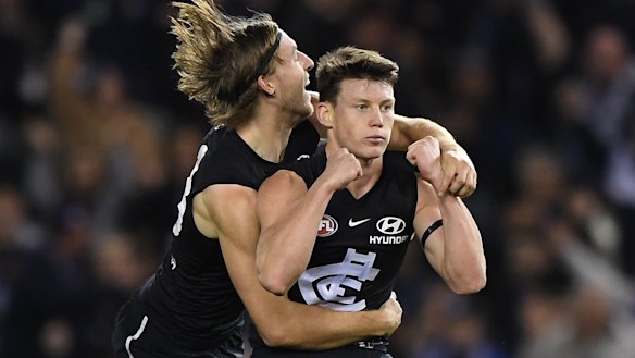 Fast starter: Sam Walsh (right) helped Carlton get out to a first-quarter lead against West Coast.