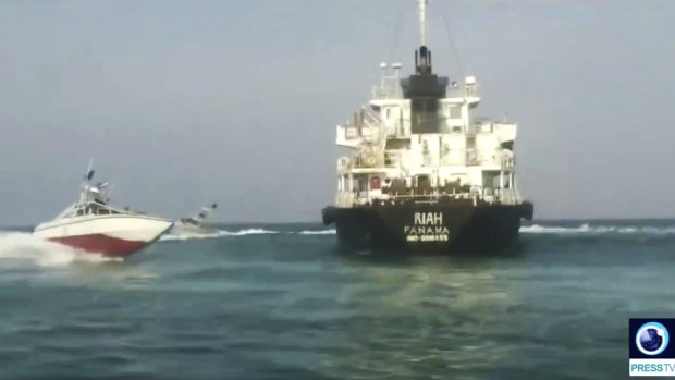Panamanian-flagged oil tanker MT Riah 
surrounded by Iranian Revolutionary Guard vessels, shown on Iranian-state TV.