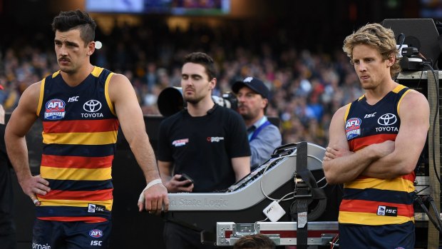 Pictured after their 2017 grand final loss, gun forward Taylor Walker (left) will now share captaincy duties with Rory Sloane.