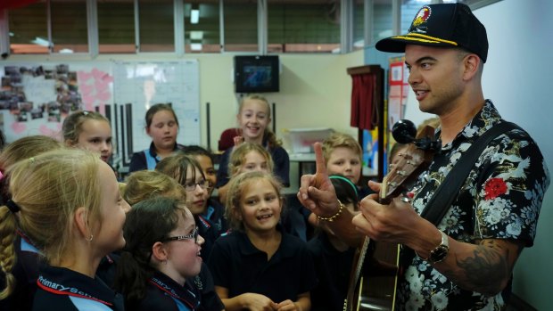 Guy Sebastian with children of Challice Primary in the ABC documentary Don't Stop The Music.