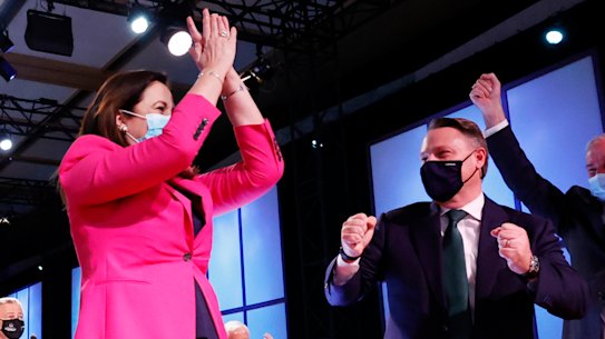 Annastacia Palaszczuk and Adrian Schrinner celebrating in Tokyo last year.