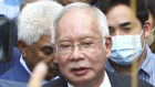 Former Malaysian Prime Minister Najib Razak, center, speaks to supporters outside at Court of Appeal in Putrajaya, Malaysia on Tuesday before his final appeal was dismissed.