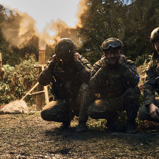 Ukrainian soldiers fire in the recently retaken Kupiansk in the Kharkiv region, Ukraine.