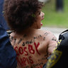 Bill Cosby retrial begins after topless protester detained