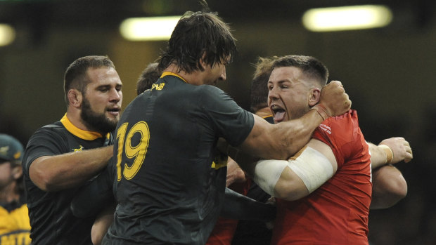 Feisty: Wales' Rob Evans (right) and South Africa's Eben Etzebeth tussle during the match.
