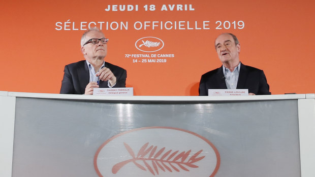 Festival director Thierry Fremaux, left, and festival president Pierre Lescure in front of the 2019 Cannes International Film Festival poster.